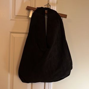 The Row “Bindle” bag in black suede